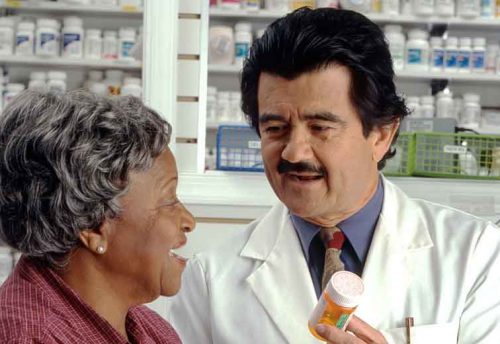 doctor and patient reviewing prescription